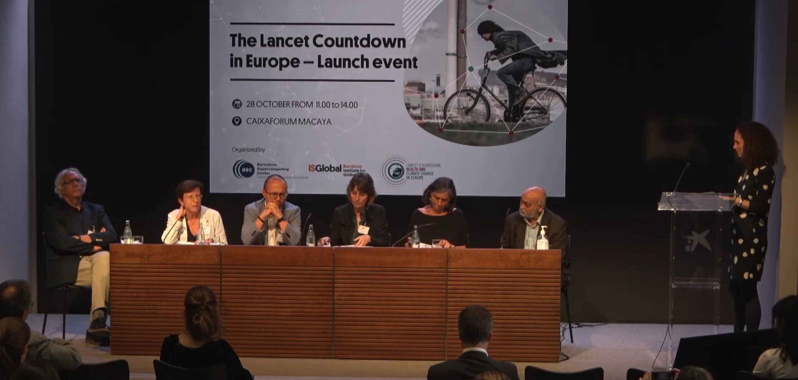 Panel discussion at the Lancet Countdown in Europe launch event, with a large event banner displayed behind the speakers.